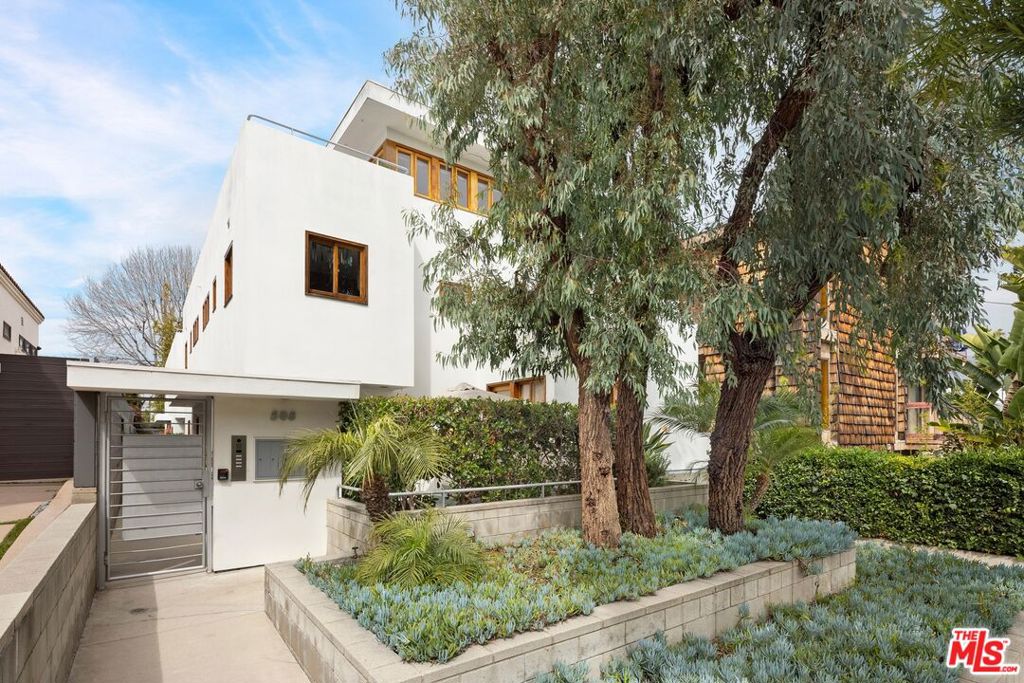 An exquisite architectural tri-level townhome sited between Ocean Park and Rose Avenue, mere blocks from the Beach. Vast open plan light-filled rooms with loft-height ceilings and clerestory ribbon windows, numerous walled outdoor spaces and terraces, and a stunning treetop patio. Remodeled Primary suites on the first level with ample closet space, beautifully maintained kitchen, dining, and living spaces on the second floor, and topped with a balconied loft on the upper level. A quiet, serene neighborhood, yet close to both Santa Monica's Main Street and Abbot Kinney's revered Boutiques and Restaurants. Newly updated floors and paintwork throughout. Large storage unit within the garage, two covered parking spaces under the unit. Xeriscaped garden with mature trees, part of a self-managed 4-unit complex, this unique fully furnished residence is available for lease.