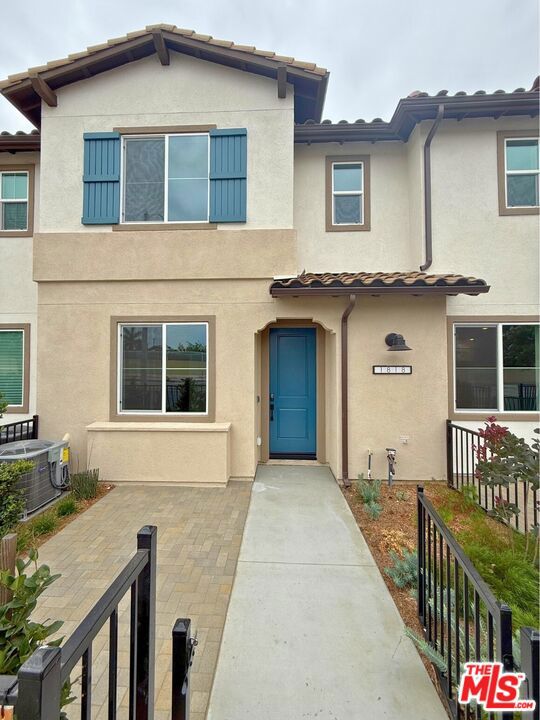 No Mello-Roos! This move-in ready home in West Covina delivers the kind of homeownership experience that's getting harder to find - contemporary, low-maintenance, and ready when you are! This home at The Grove at Merced has a delightfully landscaped front patio which offers a warm, private entry and a rare outdoor retreat - ideal for enjoying quiet mornings or winding down in the evenings. Only a limited number of homes in the community offer this fully finished patio feature, making it a standout opportunity. Inside, the first-floor impresses with 9-foot ceilings and a bright, expansive great room that feels both spacious and inviting. Whether you're hosting friends or enjoying a night in, this open-concept layout adapts with ease. The kitchen anchors the space with clean-lined cabinetry, quartz countertops, and generous prep areas - blending style with everyday function. Upstairs, the primary suite is inviting and well-equipped, featuring two walk-in closets and an en-suite bath designed with everyday convenience in mind. The dual vanity offers plenty of counter space, and a wide vanity mirror adds brightness across the room. A standing shower with tasteful finishes completes the space - functional, comfortable, and easy to enjoy day to day. Two additional bedrooms offer versatility for guests, a home office, or family members, with convenient access to a secondary bathroom featuring a shower-over-tub combination. A spacious upstairs laundry room includes room for side-by-side appliances and extra storage. Energy-efficient features throughout the home contribute to year-round comfort and reduced utility costs. The attached two-car garage provides secure parking and storage flexibility for everyday essentials or weekend gear. With solar options available for lease or purchase - and no waiting required - this home is ready for move-in today. Some photos and virtual tour are of the model home and used for representational purposes only.