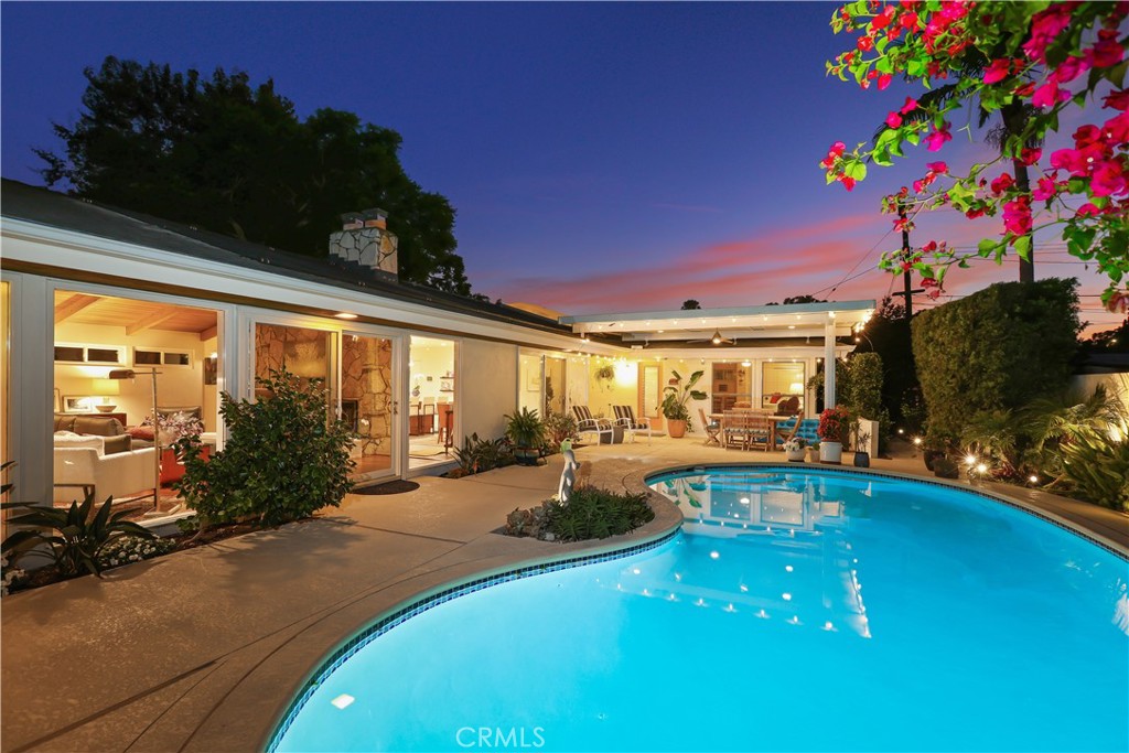 Mid-Century Modern custom home by Ralph C. Day, with a full renovation that blends timeless architectural detail with modern comfort. Main home is 2,011 square feet in addition to a casita that has 327 sqft. This rectilinear residence wraps around a private pool with sliding doors for a true indoor-outdoor lifestyle. Property is set on a spacious 8,832 sq ft lot with a resurfaced pool with 10 owner owned solar panels to keep the pool warm year round. The pool equipment has recently been upgraded and equipped with an ultra UV machine that helps reduce any chlorine smell. Enjoy a newly resurfaced patio with custom cover, built-in lighting, and ceiling fan. The backyard also has a private garden with a new irrigation system and modern rain sensor sprinkler controller for its avocado, tangerine, orange, and lemon trees.
The home retains iconic period features—extra-wide front door with center knob, walls of glass, open beam ceilings, and a striking stone fireplace—while enjoying the benefits of a full modern remodel. The kitchen has been completely redesigned with custom finishes, while all three bathrooms have been luxuriously updated. New energy-efficient Anderson windows and sliding glass doors bring in abundant natural light and an open feel to the private pool for a true indoor-outdoor lifestyle.
Large two-car garage with refinished epoxy floors, abundant storage, and an extra storage space that can be converted into a kitchenette to the casita room. The remodeled casita has its own bathroom, water heater serves perfectly as a guest retreat, studio, or private office. The walkway leads out to a separate exit door making it a perfect future ADU conversion.
Additional updates include a tankless water heater, central A/C, new lighting throughout, ceiling fans, updated blinds, security system, and ample driveway parking with Tesla electric vehicle charging station. Additionally, the home has been re-plumbed with PVC Piping in 2021, and the owner has cleared the plumbing of the house to the city line drain removing any built up calcium over the years.
Located in the highly desirable Morrison Park neighborhood—surrounded by architecturally significant custom homes, close to award-winning schools, three parks, and tennis courts, main place mall, choc hospital —this is a rare opportunity to own a completely remodeled Mid-Century Modern masterpiece that balances history, comfort, and luxury.