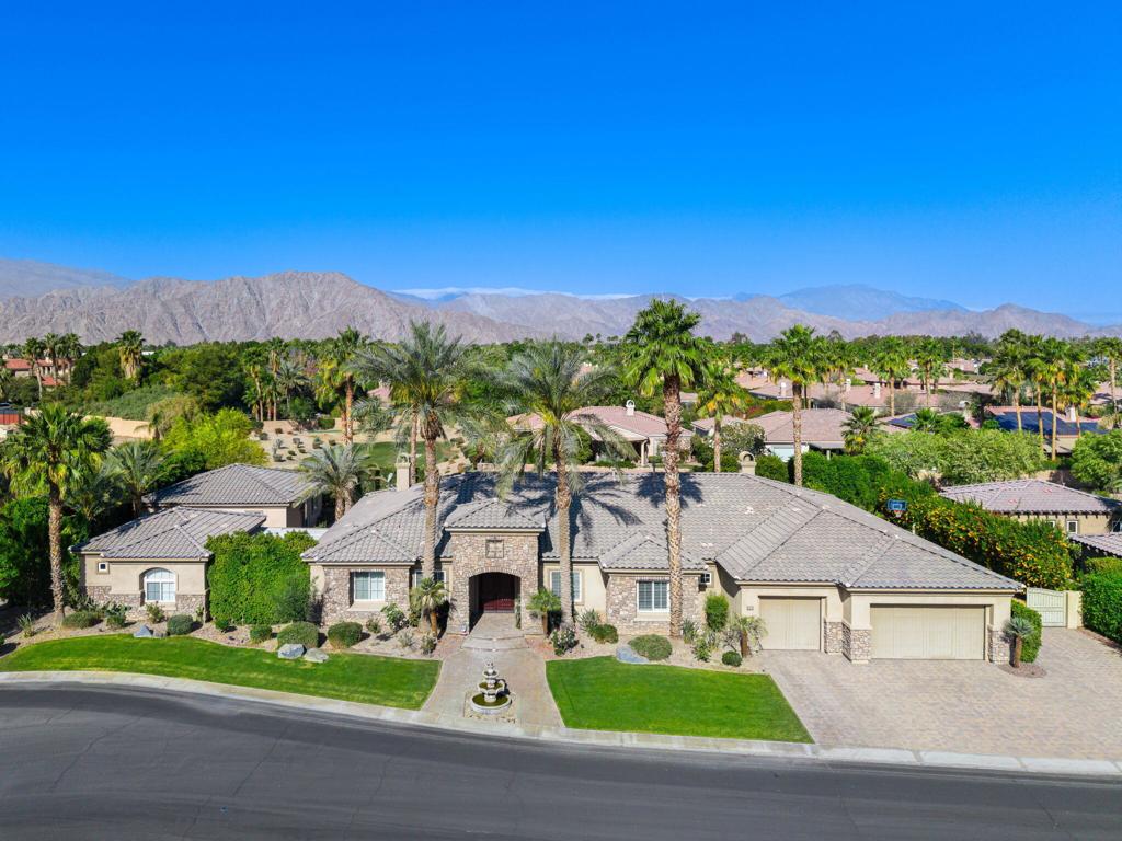 Ultimate Desert Retreat Just Steps from the Polo Grounds! Welcome to your own private resort in the heart of the Coachella Valley, an exceptional estate offering over approximately 5,500 square feet of luxurious living space, just steps from the world renowned Polo Grounds, home to the iconic Coachella and Stagecoach festivals. This expansive property features 7 bedrooms and 6.5 bathrooms, including a stunning main residence with 4 bedrooms and 4.5 baths, and two separate, private casitas, ideal for guests, multigenerational living, or lucrative rental opportunities. Casita One spans approximately 600 sqft, offering two rooms, a full bathroom, a convenient kitchenette, and a walk-in closet. Casita Two is an impressive 900 sqft, designed with comfort and function in mind, featuring a spacious living room with fireplace, a full kitchen adorned with quartz countertops and island, 2 bedrooms, 1 bathroom, and its own laundry room. Outdoors, indulge in the epitome of desert luxury with a sparkling pool and spa, outdoor kitchen, motorized awnings, mister system, and RV parking, all surrounded by mature landscaping and fruit-bearing trees. The Santa Rosa Mountains provide a breathtaking backdrop, enhancing the tranquil ambiance of this desert oasis. And when it's time to entertain? Gates from the backyard open up to an expansive entertainment area featuring a bocce ball court and manicured greens, perfect for gathering, playing, and soaking up the desert sunshine.Additional highlights include a 3-car garage, sunshine year-round, and an unbeatable location with walkable access to world-class festivals, equestrian sports, golf, tennis, and endless entertainment. Whether you're seeking an investment property with exceptional rental potential, a lavish vacation getaway, or a year-round residence that feels like a private resort, this extraordinary estate checks every box. Luxury, location, and lifestyle await, schedule your private tour today.