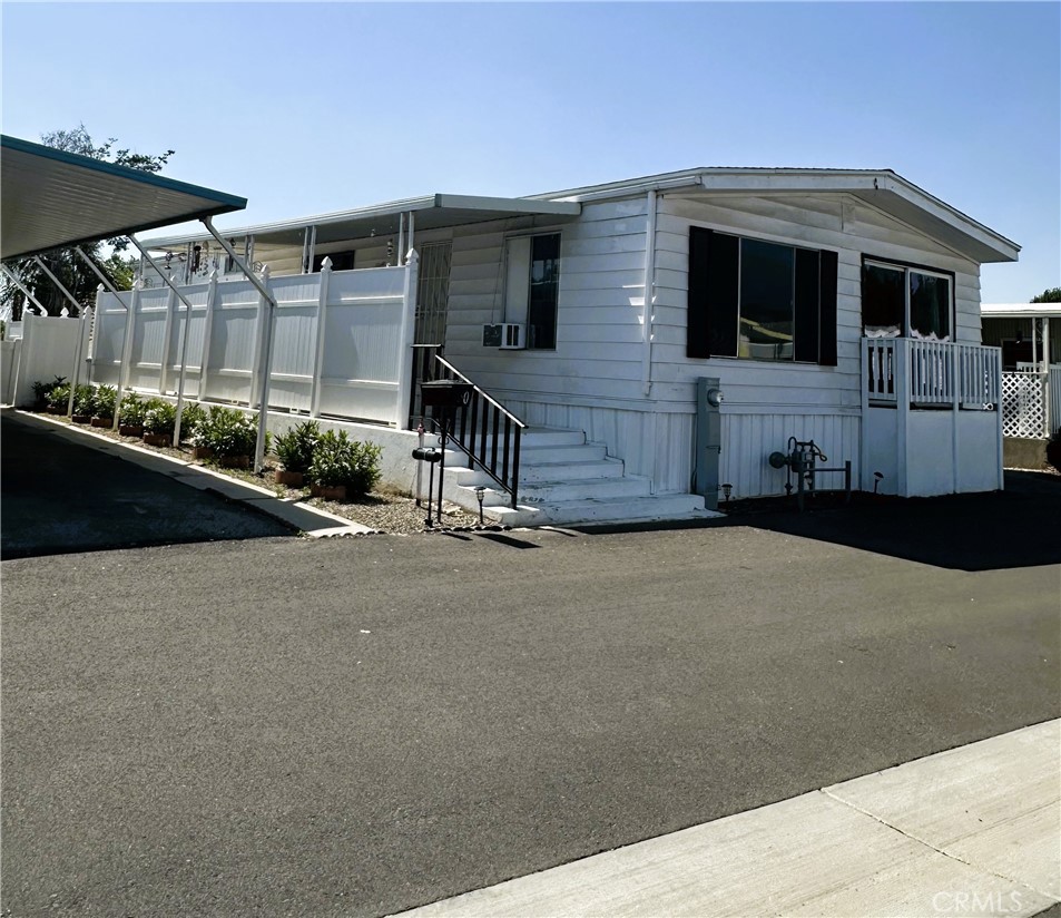Spacious 2-Bedroom Home in Renovated Senior Community – Mountain Views Included!
Welcome to your new home in the beautifully upgraded California Mobile Home Park, a premier 55+ community now under new ownership! This serene park has been thoughtfully revitalized with freshly paved roads, a replastered swimming pool, a remodeled clubhouse, and expert on-site management—creating an ideal setting for relaxed and carefree living.
Step inside this extremely spacious 2-bedroom, 2-bath home boasting over 1,400 square feet of comfort and style. The airy vaulted ceilings create an open and inviting atmosphere throughout the living room, family room, and formal dining area, perfect for entertaining guests or enjoying quiet evenings at home.
The updated galley kitchen features crisp white appliances—including a stove, refrigerator, and built in oven—along with a convenient sit-down bar for casual meals. A separate laundry room adds practicality, while the new, oversized HVAC system ensures year-round comfort.
Retreat to the generously sized master suite complete with a walk-in closet, double sinks, a vanity area, and a private water closet with shower. The guest bedroom is equally spacious and enhanced with mirrored closet doors, adjacent to a beautifully remodeled guest bath featuring a modern, tiled shower.
Wow also enjoy this home with brand new carpet and a new roof.
Enjoy your morning coffee or evening breeze from the large porch or balcony with stunning mountain views. The home also includes a covered carport for added convenience and brand new carpet throughout for a fresh, move-in-ready feel.
Don’t miss your chance to live in this vibrant and welcoming senior community—schedule your private tour today!