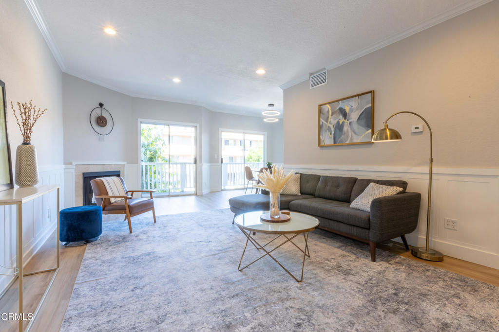 Welcome to 5135 Zelzah Ave #107 -- a sun-filled, east-facing residence that checks all the boxes. Thoughtfully updated with a brand-new kitchen, refreshed bathrooms, laminate flooring, updated lighting, and fresh paint throughout, this beautifully finished unit is bathed in natural light and has a warm, elevated feel. The generous primary suite features a walk-in closet and private bath, while the open-concept living room with its cozy fireplace creates an inviting space to relax or host. Enjoy amenities including a pool, secured entry, and two gated parking spaces -- all just one block from the shopping, dining, and energy of Ventura Blvd.