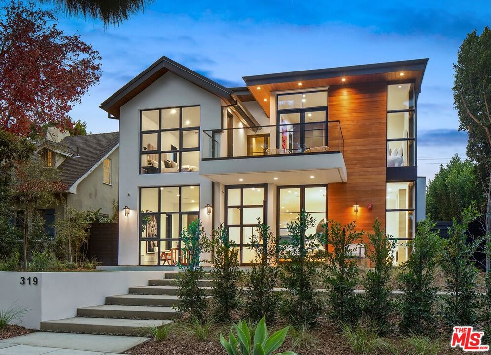 The generous size and graceful floorplan cannot be replicated under the new building ordinances, making this incredible new home truly one-of-a-kind! Open and airy with high ceilings throughout, this three-level, flexible-use floorplan lends itself to a variety of lifestyles. The 22ft wide glass pocket doors open completely allowing the indoors to flow seamlessly out with continuous 4'x4' Italian tile into a covered outdoor living and dining space. A floating staircase takes you upstairs to 4 en-suite bedrooms. The sophisticated master suite features a spa-perfect stone bathroom with a huge bianco macchia vecchia marble rain shower and double sinks plus freestanding soaking tub. The lower level features a large mirrored gym, tiered and sound insulated theater, wine tasting room and entertainers bar with marble countertop plus a guest bedroom with full bath. An impeccably designed backyard, permitted and ready for a beautiful pool, is at the top of its class! Triple island BBQ kitchen with custom tile accent wall and granite countertops plus a huge picture-perfect turf lawn is the entertainer's dream. Flawlessly executed, this home is understated while impressive without rival.