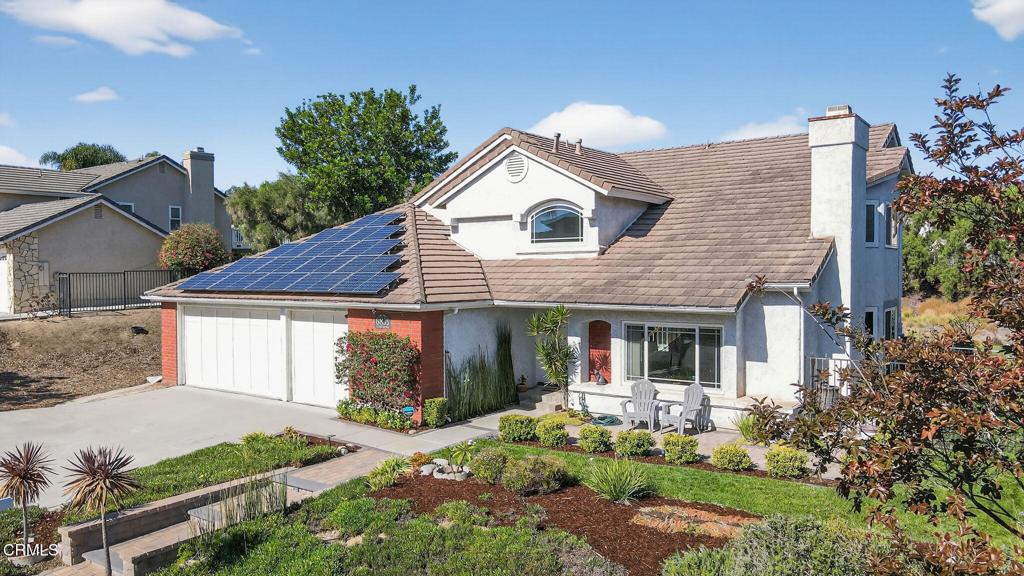 Set on a peaceful half-acre, with incredible views, in one of Camarillo's most inviting neighborhoods, this 2,574 sq. ft. home offers a wonderful place to settle down. You'll love the sense of openness, natural light, and privacy that make this home feel like a private retreat. The custom front walk-way and patio welcome you into the home. Inside, the open layout filled with natural light and high ceilings create a sense of airiness throughout while the floor plan flows effortlessly. A formal living room invites you to settle in by the fireplace while the dining room leads to a side patio for outside dining. The wet bar with custom wood countertop is adjacent to the family room which is highlighted by a fireplace and slider to the backyard making entertaining easy. The kitchen's boasts a walk-in pantry and garden window that perfectly frames the mountains adding enjoyment while cooking. The downstairs features a spacious bedroom with vaulted ceiling, and slider to the backyard -- perfect for guests or a home office with its own outdoor access. Upstairs, the primary suite features vaulted ceilings, dual sinks, a walk-in closet, and a private balcony to take in the panoramic views. Two additional bedrooms share a convenient full bath. Retreat to the backyard for relaxing and entertaining -- with multiple patios, raised garden beds, and 'infinity' grass that seamlessly stretches toward the breathtaking views. Fruit trees (avocado, orange, guava, lemon, grapefruit, and fig) adorn the property, offering both beauty and bounty -- perfect for pets, play, and views. The oversized 3-car garage offers room for vehicles, storage with space for hanging out or working on projects. With an owned 4.25 kW solar system and smart home features including connected thermostat, irrigation, and security systems, this home blends modern comfort with peaceful, view-filled living. It's the perfect mix of beauty, function, and serenity -- a home you'll never want to leave.