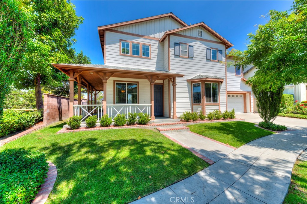 Beautiful 3-Bedroom, 2.5-Bathroom Home on a corner lot with plenty of privacy. This home features a formal living room and dining area, along with a spacious yet inviting family room complete with a cozy fireplace and built-in entertainment center. The gourmet kitchen is a chef’s dream, boasting Caesarstone quartz countertops, high-end stainless steel appliances—including a 5-burner Bosch stove, convection oven, microwave, and dishwasher—plus elegant mahogany-style cabinetry with glass inserts, and a custom tile backsplash. A custom-built mobile center island with a built-in trash drawer adds both style and functionality. The first floor is adorned with tile flooring and custom window coverings throughout. Additional features include ceiling fans, central air conditioning, and new exterior paint coming next week. The large primary suite offers a generous walk-in closet, private balcony, and serene views. 2 Secondary bedrooms, secondary bathroom and laundry room complete the upstairs. Spacious lot highlighted by lush landscaping, plenty of grass for playtime, charming wrap-around porch, and unique privacy—no neighbor on one side, just open grassy space, and no home behind, only a peaceful greenbelt. Located just minutes from the freeway, toll road, and shopping centers, this home also grants access to all of Ladera Ranch’s exceptional amenities: pools, tennis & pickleball courts, skate & water park, basketball courts, biking and walking trails, and more. WATER, TRASH, GARDENER, HOA and INTERNET INCLUDED!!