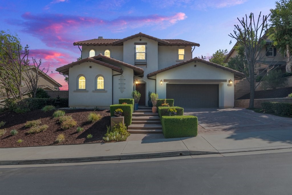 Welcome to Fox Hollow! This Taylor Woodrow former model home offers 4 bedrooms, 3 bathrooms, and a 3-car tandem garage on a beautiful tree-lined street. With 2,515 sq ft of living space on a 6,800 sq ft lot, this home is the perfect blend of style, comfort, and convenience in one of Chino Hills’ most sought-after communities. Inside, you’re greeted by soaring ceilings and an open, airy layout. The main level features two spacious living areas and a gourmet kitchen with built-in stainless-steel Monogram refrigerator, opening seamlessly to the family room and backyard. Step outside to your private retreat-style yard, where mature trees create a peaceful green backdrop and shield the space from neighboring views. With low-maintenance artificial turf, it’s ideal for family BBQs, outdoor gatherings, or simply enjoying quiet evenings in total privacy. The main level also includes: Formal living and dining rooms with wood beams, stone tile, and wood flooring, Dual-pane windows and a prewired sound system throughout, Office/bedroom with adjacent full bathroom, Laundry room with sink and direct garage access. Upstairs, the spacious primary suite offers a spa-like bathroom with soaking tub, dual sinks, and a walk-in closet with built-in organizers. Secondary bedrooms are generously sized and share a full bathroom, while the loft with custom shelving provides a versatile bonus space. Additional highlights: wrought iron staircase, recessed lighting, newer interior paint, upstairs carpeting, and central HVAC. Located in the Artisan community, this home is close to shopping, top-rated schools, parks, Chino Hills Country Club & Golf Course, and easy freeway access. A rare find with both elegance and privacy—come experience this beautiful home today!