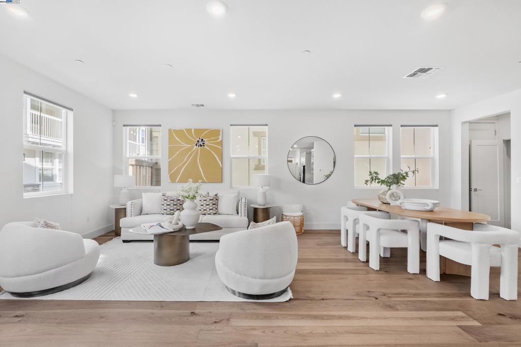 Where modern sophistication meets smart design, this impressive Newark residence boasts a spacious 2,886 SQFT of living space, perfectly accommodating its 5 bedrooms and 4.5 bathrooms. Engineered hardwood floors extend throughout the first floor. The open-concept kitchen is a chef's delight, featuring a full backsplash, quartz countertops, and top-of-the-line stainless steel appliances. Upstairs, the upgraded carpet adds a plush feel to the bedrooms, enhancing the sense of luxury. Each of the two suites offers a private retreat with its own bathroom, providing comfort and privacy. The second floor unveils a large loft, an ideal space for entertainment or relaxation. Complementing this are two generously sized patios, inviting you to enjoy the outdoors in tranquility. The home is equipped with owned solar panels that enhance energy efficiency. The Rinnai tankless water heater, Moen Flo smart water monitor, and Honeywell upgraded thermostats ensure comfort and efficiency. Bridgeway residents enjoy a host of amenities like a clubhouse, a swimming pool, dog park, and playground. Nearby National Wildlife Refuge offers open space with trails and nature to explore. Close to Meta and Tesla, among other major employers. Easy access to Dumbarton bridge and I-880.
