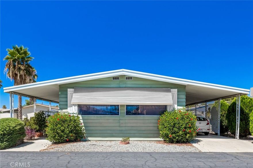 Well-maintained double-wide mobile home in Eden Roc Villa North 55+ senior rental park. Spacious floor plan with formal/dining room combo and separate family room with built-in lighted hutch. Kitchen has double oven, electric cook top, dishwasher, double sink, refrigerator and low-counter breakfast bar. Primary bedroom separate dressing area, mirrored wardrobes, tub and shower, huge counter top with seated vanity. Guest bedroom has ceiling fan, walk-in closet, and stall shower with seat. Inside laundry with gas dyer hook-up (washer and dryer stay). Both HVAC system and cost-saving evaporative cooler.  Enclosed patio room and nice outdoor seating area. Shed. Great park amenities including pool, spa, clubhouse, game room, billiards, banquet facilities, and more.