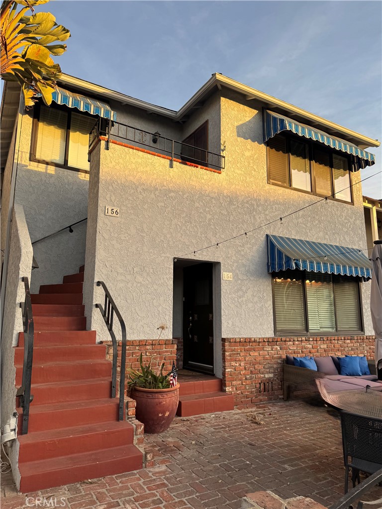 Discover this delightful duplex in Belmont Shore, ideally located just two blocks from the beach and a short stroll to an array of restaurants, bars, and vibrant city life. The lower unit boasts two generously sized bedrooms and a well-maintained bathroom with modern updates, ensuring a cozy living space. Meanwhile, the upper unit offers three spacious bedrooms and a full bathroom, providing ample room for families or gatherings. Additional features include a garage for convenient parking and a laundry area situated in the utility room. Set in a tranquil neighborhood, this property places you near all the major attractions, making it a truly exceptional opportunity in a prime location. Don’t miss your chance to make it yours!