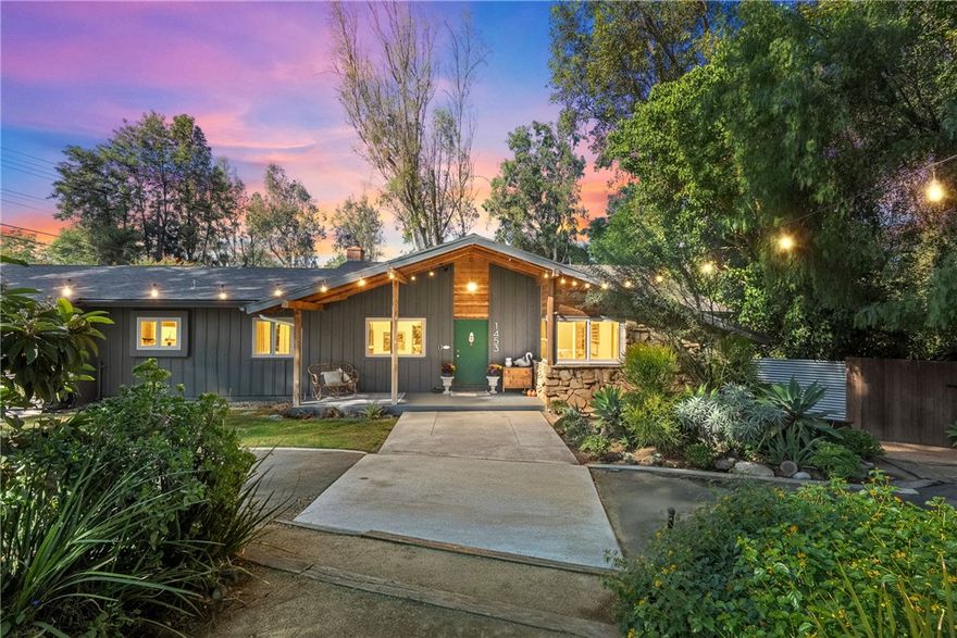Architectural Midcentury Gem in Riverside’s Coveted Whitegate Neighborhood

Tucked beneath a canopy of mature trees and surrounded by lush, garden-like grounds, this 1958 midcentury ranch by acclaimed Southern California architect William Bray blends timeless design with a serene sense of place. Resting on over a half-acre corner lot in the prestigious Whitegate community of Hawarden Hills, the home offers a rare combination of architectural pedigree, privacy, and effortless indoor-outdoor living. A horseshoe driveway winds through beautifully landscaped grounds, leading to a dramatic entry marked by a pitched roofline and exposed wood beams—an early hint of the artistry within. Inside, the home’s signature midcentury character shines through natural materials, vaulted wood-beamed ceilings, and walls of glass framing peaceful views of the backyard and pool. The living and dining areas flow seamlessly together, centered around a cozy fireplace and opening to an expansive wood deck overlooking the gardens. The galley-style kitchen honors the home’s vintage spirit while offering abundant cabinetry, generous counter space, and a sunny breakfast nook. A separate family room with built-in storage and direct deck access provides the perfect space for relaxing or entertaining. With three bedrooms, two baths, and a flexible office or art studio, the home also features a greenhouse and basement-style storage beneath the rear section—ideal for creative projects or additional utility space. Celebrated on local home and garden tours, this thoughtfully preserved residence has been meticulously maintained and sensitively upgraded to enhance comfort without compromising its architectural soul. A true Southern California retreat, this home embodies easy, refined living—where design, nature, and tranquility come together beautifully in every season.