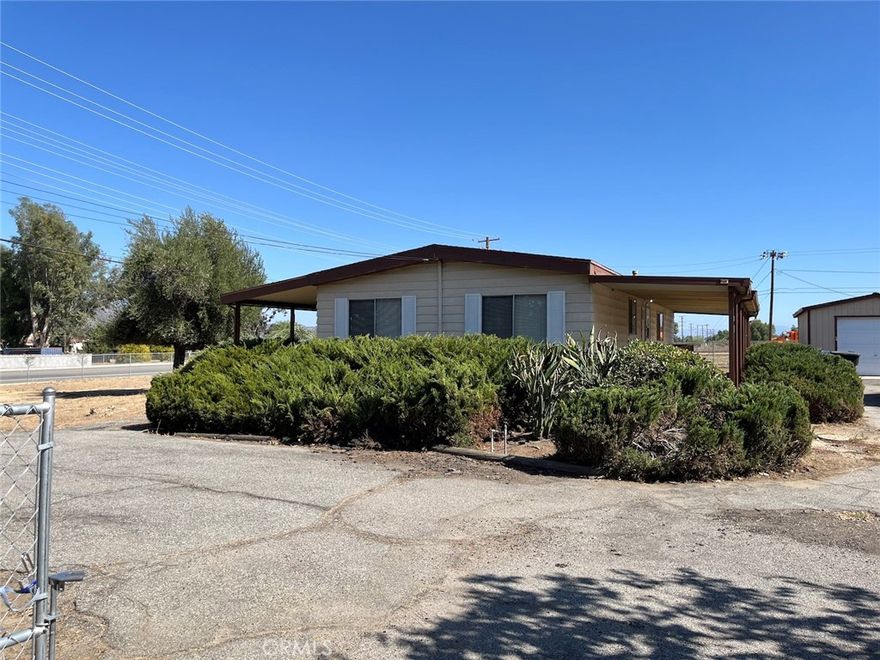 2 bed, 2 bath, manufactured home on a large lot. Also has a 2 car garage/storage and a circular driveway. Lots of the flooring has been updated. Window blinds throughout.