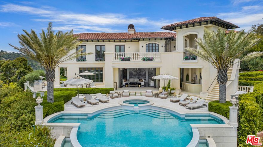 Introducing 1940 Bel Air Road, an exquisite estate nestled in one of the most prestigious neighborhoods in the world. Boasting a sprawling 17,000 square feet of luxury living space, this extraordinary property offers a truly exceptional lifestyle. Set against the picturesque backdrop of the Stone Canyon Reservoir, this home presents captivating views and unparalleled tranquility. Step through the grand entrance and immerse yourself in a world of opulence. Every detail has been meticulously crafted, showcasing some of the finest quality and craftsmanship throughout. From the soaring ceilings to the carefully curated finishes, this residence exudes elegance and sophistication at every turn. The expansive floor plan provides an abundance of space for both entertaining and everyday living. Discover multiple living areas, including a magnificent formal living room, a cozy family room, and a stately study, each offering its own unique ambiance. The gourmet kitchen is a chef's dream, featuring top-of-the-line appliances, custom cabinetry, and a generous island, all designed to inspire culinary excellence. Indulge in the ultimate relaxation within the private primary suite, which encompasses a serene bedroom, a luxurious spa-like bathroom, and a spacious walk-in closet. Additional ensuite bedrooms offer comfort and privacy for family and guests alike. As you venture outside, an oasis awaits. Breathtaking views of the Stone Canyon Reservoir create a sense of serenity and provide an idyllic backdrop for outdoor gatherings. Immerse yourself in the lush, landscaped grounds, featuring meticulously manicured gardens, a sparkling pool, and ample patio space for al fresco dining and entertaining. This prestigious Bel Air estate offers not only an exceptional living experience but also an unparalleled location. Situated in one of the most coveted neighborhoods in Los Angeles, residents enjoy the convenience of nearby amenities, world-class shopping on Rodeo Drive, and fine dining establishments.