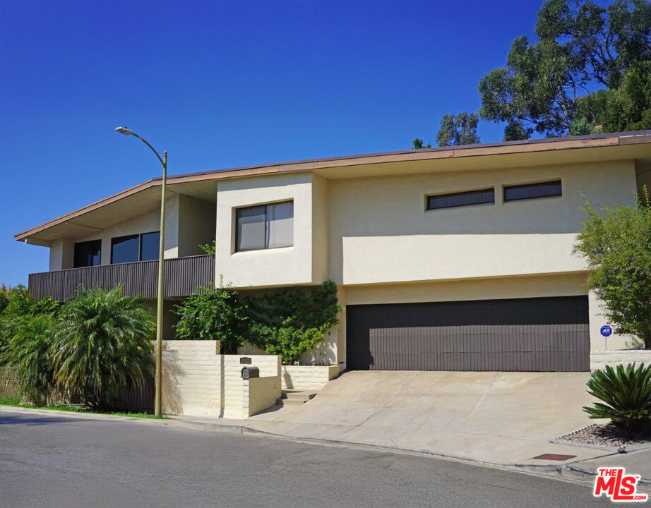 Opportunity to reimagine a Classic 70's Architectural property located on a quiet cul-de-sac in BHPO. This home was build in 1973 in the Mid Century era. The breakfast and kitchen areas provide picturesque views of the city down below and as far as the coastline. The primary bedroom suite features a walk in closet plus additional closet space. There are 2 additional bedrooms, a bathroom and powder room adjacent to the Primary Suite. On the entry level there is a bedroom and bathroom. Currently the home is located in the Warner Avenue School District. Broker does not guarantee the accuracy on the information provided, including square footage, lot size, permitted and unpermitted spaces and/or bedroom/bathroom count. Buyer is advised to independently verify the accuracy of this information through personal inspection, building permits and/or appropriate professionals (i.e. attorney, appraiser architect, surveyor, etc.).