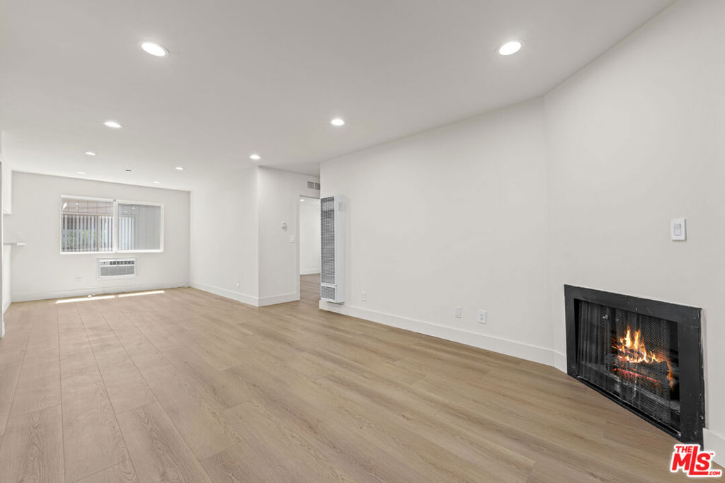 Stunning 2 Bed / 2 Bath in the Heart of West Hollywood. Welcome to your private retreat in one of West Hollywood's most sought-after locations. This beautifully remodeled second-floor unit offers 2 spacious bedrooms and 2 modern bathrooms, enclosed behind a secured entry door for maximum privacy and peace of mind. Step inside to find elegant wood flooring throughout and a bright, open layout. Enjoy your morning coffee or set up a perfect work-from-home space on the covered patio, designed for comfort with shaded privacy.The location is truly unbeatable just steps from the Pacific Design Center, Urth Cafe, and world-class shopping and dining along Melrose Avenue. Whether you're looking to work, relax, or explore, everything you need is right outside your door.This unit combines modern style, convenience, and security in the best part of West Hollywood.