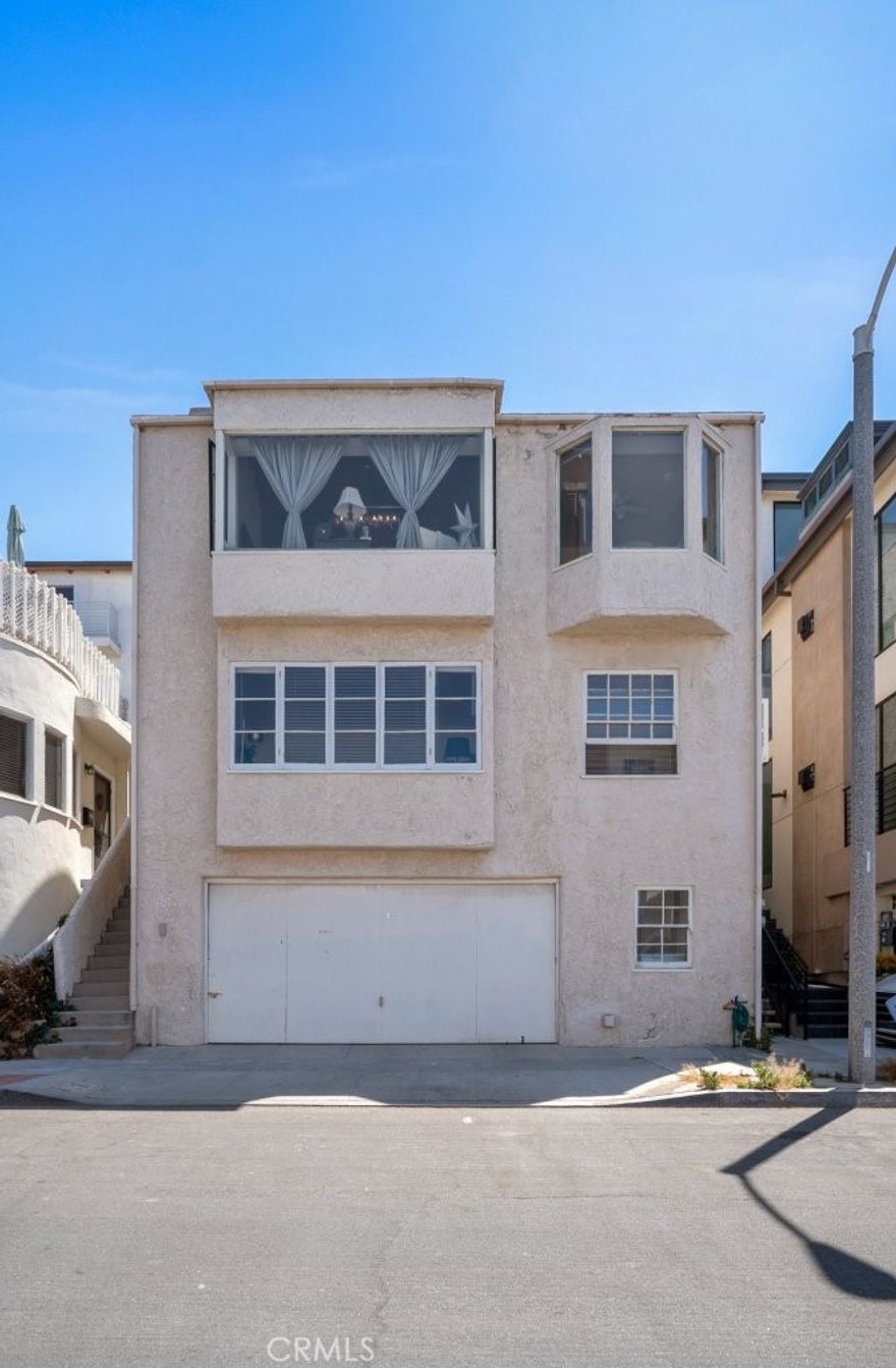 Just steps from the sand in North Manhattan Beach, 3012 Manhattan Avenue is a rare duplex offering with extraordinary upside. Currently improved with two upgraded 2-bedroom, 1-bath units, the property sits on a uniquely steep, elevated lot that unlocks dramatic, panoramic ocean views—a vantage point few neighboring homes can match.

For buyers with vision, preliminary plans by renowned architect Louie Tomaro are included, providing a head start on creating a world-class coastal estate. Design possibilities include a stunning four-level single-family home with an attached luxury ADU studio—perfect as a guest retreat, private office, or income-producing rental. The existing two-car garage and upgraded infrastructure further enhance the property’s long-term value.

Surrounded by vibrant dining, boutique shopping, and beachside nightlife, this property is equally compelling as a development opportunity today or a strategic buy-and-hold investment in one of Manhattan Beach’s most coveted neighborhoods.