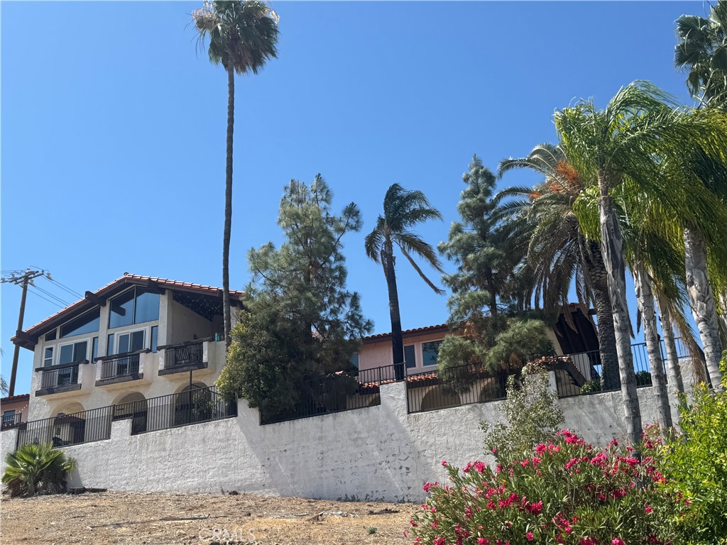 Amazing views in this Canyon Lake 4 bedroom, 3 bath home. This flag lot home has plenty of parking and a large yard. The home has been nicely remodeled and has a an open floor plan and views of the lake. There is plenty of parking, washer/dryer and refrigerator included as well as the 2 car garage and an electric car charger is available for your use! The lower level of the home is leased separately and there is a separate entrance for the tenant.