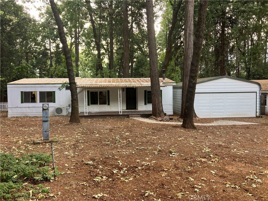 This home features a detached two car garage, a wood stove to cut fuel cost in the winter, a new mini-split heating and cooling unit, and access to Paradise Pines Property Owners association amenities for a low annual fee.  It also has new kitchen cabinets, new paint inside and out, located in a quite area surrounded by mature trees. Bathrooms are spanking new too. Large fenced back yard. Dual pane window(s).