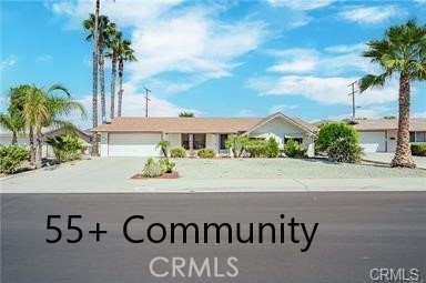 Charming 3-Bedroom Home in a Desirable 55+ Community in Menifee! Welcome to this beautifully maintained 3-bedroom, 2-bath home nestled in the sought-after 55+ community of Menifee. This inviting residence offers a spacious open floor plan with tasteful wood-style flooring throughout, ceiling fans for added comfort, and plenty of natural light. The heart of the home is the lovely, centrally located kitchen—perfect for entertaining—featuring solid surface countertops, crisp white cabinetry, a flat-surface cooktop, stainless steel double sink, and a convenient breakfast bar. Enjoy comfortable living with a generous living room, formal dining area, and a dedicated indoor laundry space. Step outside to relax or entertain under the expansive covered patio. Additional highlights include a two-car garage and a large separate workshop—ideal for hobbies, storage, or projects.