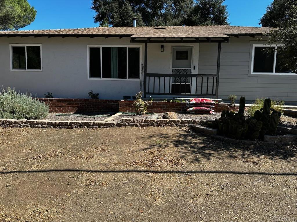 Welcome to this charming single-level 3-bedroom, 2-bath home in the desirable Lake Morena area of Campo. The home features a freshly painted interior, handmade wood barn closet doors, new closet doors, and new bedroom windows. Upgraded bathrooms with beautiful tile flooring, new vanities. The beautifully updated kitchen boasts quartz countertops, and all appliances convey. Separate laundry room w/plenty of new cabinets. Permanent safe in bedroom closet for convenience storing your valuables. Newer roof 3yrs new. Recent upgrades include newer vinyl flooring, central AC, newer water heater, and all new breakers in the electrical panel. The inviting living room is highlighted by a cozy wood-burning fireplace. Enjoy outdoor living with a fully fenced backyard, newer landscape and new cement patio and front walkway, two storage sheds, and plenty of space for an RV, complete with RV clean-out in the backyard. The exterior has new durable Hardie siding installed for long-lasting curb appeal. Front and backyard rain gutters. A generator hookup and transfer box in closet adds convenience and peace of mind. Perfectly situated close to Lake Morena, this home offers easy access to fishing, hiking, biking, and nature trails—ideal for those seeking country living with modern updates. Eligible buyers may also apply for a $2,600 grant for fascia.