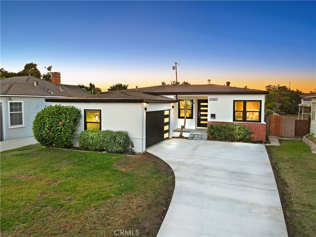 Remodeled 4-bedroom, 2-bath home features a brand new kitchen with new cabinets, quartz counters and stylish tile backsplash. The large primary bedroom has a walk in closet and ensuite bathroom with new sink/vanity & large tile shower, while the hall bathroom has a new tub/shower and is all new as well. You'll feel right at home in this warm living room and dining area with new flooring. Additional highlights include an inside laundry room, new windows, recessed lighting, a new water heater, new electrical panel, new central air & heat. The exterior boasts new paint, a sharp new front door, and a 2-car attached garage with an automatic opener. This move-in ready home is truly a must-see!