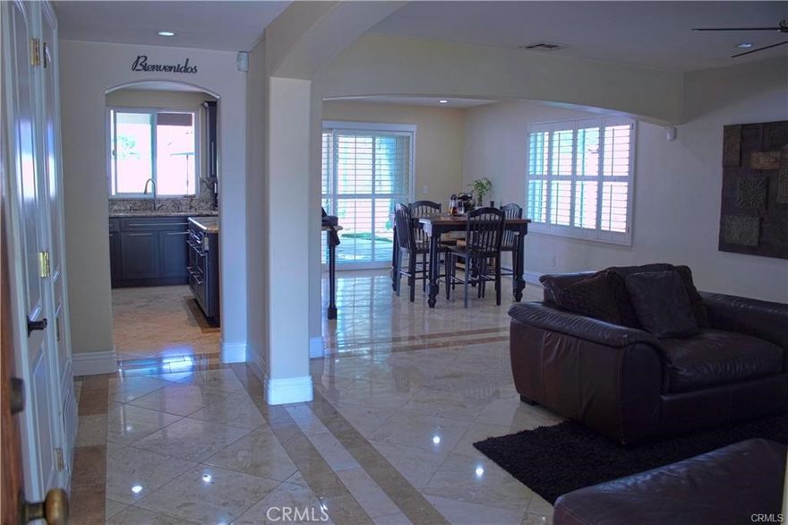 California living at its best! This beautifully updated home offers the perfect blend of relaxation and entertainment. Enjoy a sparkling pool, built-in BBQ with natural gas connection, stamped concrete patio, and a covered outdoor dining area all in a resort like atmosphere. The open-concept kitchen features an oversized granite island, recessed lighting, and direct flow to the living and dining areas. The expansive primary suite, converted from two bedrooms, has room for a nursery or home office along with two additional well-appointed bedrooms Elegant finishes include travertine flooring, custom shutters, and a gas fireplace. Spa-inspired bathrooms feature a jetted soaking tub and a walk-in shower. Upgrades include new dual-pane windows, sliding doors, a new 4-ton HVAC System with heat pump for efficient year-round comfort and a wireless ADT alarm system. In addition, the 2-car garage offers the potential to build an ADU and generate extra income in this highly sought-after Wells Hills area. The home offers a perfect blend of comfort, style, and privacy in a sought-after West Hills neighborhood. Call me for a private tour. Act now!.