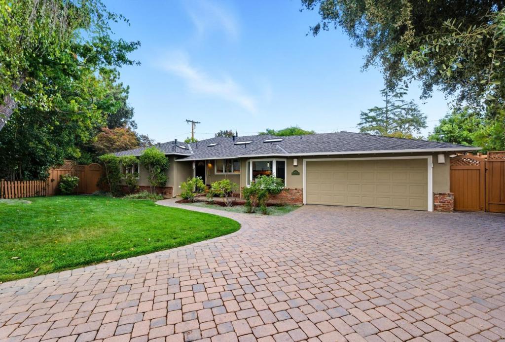 Resort Living, Los Altos Style. Welcome to 1660 Elmhurst Drive, where everyday ease meets resort-style living. This sun-drenched single-story retreat is tucked away on a quiet cul-de-sac in one of Los Altos' most prestigious neighborhoods, a rare opportunity where comfort, convenience, and community come together. Featuring 4 bedrooms, 2.5 bathrooms, and an executive office, the home offers both refined and relaxed spaces for modern living. The formal living and dining rooms set the stage for memorable gatherings, while the separate family room with sliding doors creates an effortless connection to the outdoors. Skylights throughout bathe the interiors in natural light, enhancing the home's inviting warmth and open feel. The serene primary suite includes a spa-inspired bath and a large walk-in closet, providing a private sanctuary at day's end. Step outside to discover your personal weekend retreat: a sparkling pool, hot tub, trampoline, and patio designed for fun, relaxation, and entertaining. With top-rated Los Altos schools, lush parks, charming Village shops, and world-class Silicon Valley campuses just minutes away, this is more than a home; it's an opportunity to embrace the best of Los Altos living, all on one effortless level.