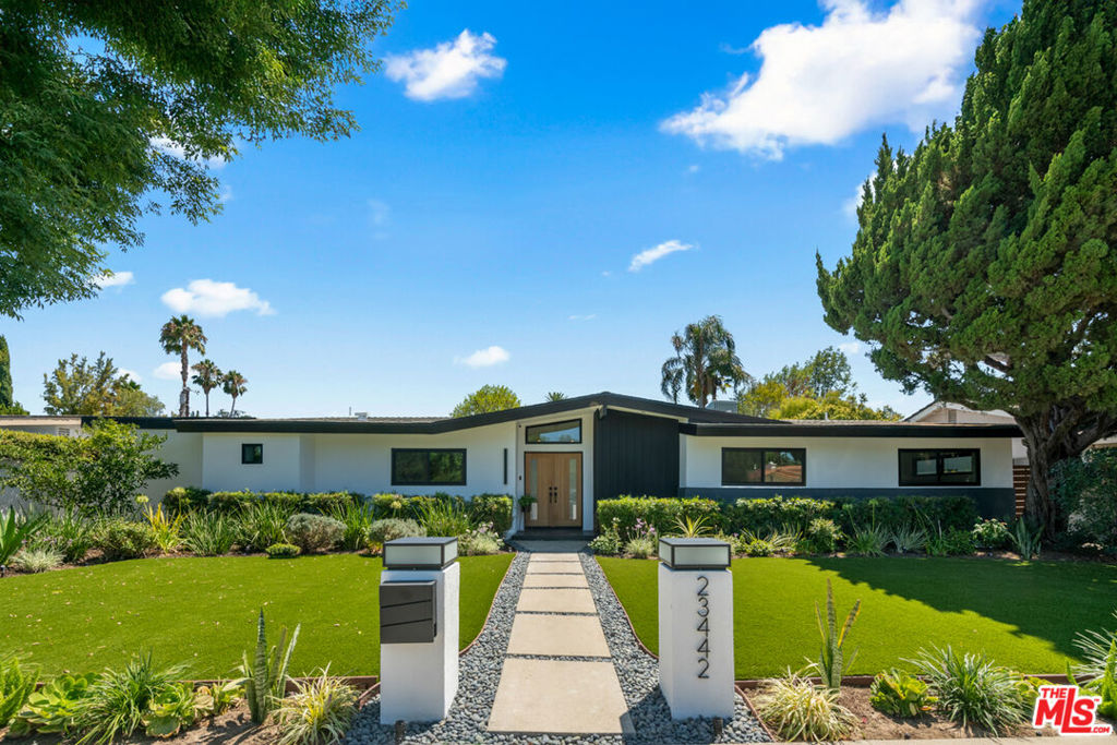 Welcome to an exquisite residence nestled in the prestigious Walnut Acres area of Woodland Hills, CA, on the quiet part of Burbank Boulevard. This Charles du Bois-design home embodies elegance and modern sophistication, offering a harmonious blend of mid-century charm and contemporary upgrades. Award-winning schools and walking distance to El Camino Real Charter High School. Step inside to discover a meticulously modernized and renovated interior, featuring a spacious 2,195 square-foot layout. The home provides three elegantly appointed bedrooms and three luxurious bathrooms. The heart of the home is the chef's kitchen, showcasing quartz counters, a magnificent center island, and a 36" Thor gas range. Stainless steel appliances and a walk-in pantry complete this culinary haven, while a wet bar with a wine fridge and a glass-enclosed wine closet caters to the most discerning entertainers. Experience the seamless flow of the living spaces, which include a formal dining room. Dual fireplaces elegantly serve both the living room and family room, which open onto the sprawling backyard, inviting you to a serene outdoor retreat where a sparkling new pool with new pool equipment awaits, surrounded by lush landscaping and dazzling landscape lighting.The primary suite is a sanctuary of its own, with access to the beautiful backyard and pool, complete with an abundance of closet space and a beautifully designed en-suite bath with dual sinks, a separate soaking tub, shower and water closet. Smart home features include a Nest thermostat, a Ring doorbell, and a comprehensive security system with cameras that ensure peace of mind. A brand new roof, new Milgard double-pane windows and sliders and fully paid-for solar panels underscore the home's commitment to efficiency and sustainability. Other features include a full indoor laundry room, an oversized two-car garage that offers additional storage or workshop space, complemented by a gated driveway that accommodates four additional cars for off-street parking. Proximity to Calabasas for shopping and fine dining. A must-see for discerning buyers looking for a home that has it all!