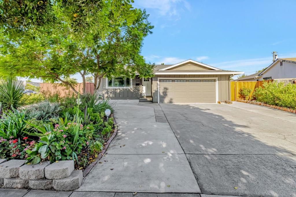 Welcome to 403 Mignot Lane! Beautifully maintained home on a quiet street, set on a generous 10,351 sq. ft. lot with potential for a lot split or ADUs. The kitchen, bathrooms, garage, A/C, and ceiling insulation were upgraded in 2018, with the kitchen and bathrooms recently refreshed with new fixtures. Inside, enjoy Pergo laminate flooring and recessed lighting move-in ready. Step outside to a private backyard retreat with a deck, covered patio, koi pond that adds to the homes good feng shui, wooden shed, and fruit trees including apple, fig, peach, persimmon, and passion fruit. Conveniently located near schools, parks, shopping, and freeway access, this home offers comfort today with huge potential for tomorrow. Grasp this amazing opportunity!
