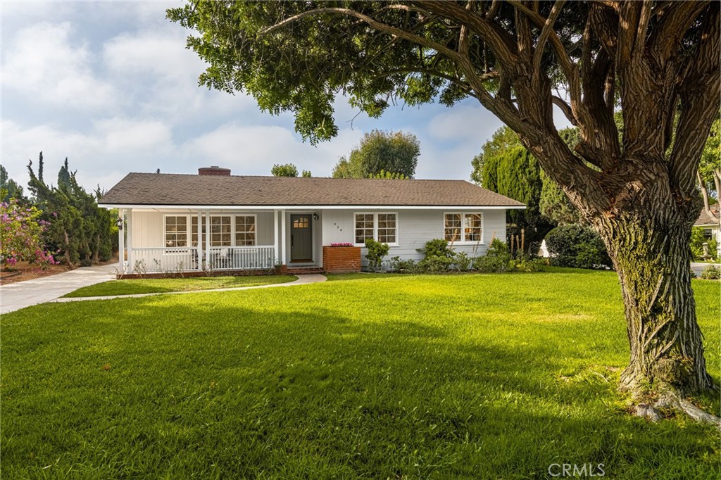 Dreaming of a tree-lined street, where spacious front yards and the ease of walking to top-rated neighborhood schools still exist? Discover Sunny Hills, one of Fullerton's most coveted enclaves, where privacy, space and timeless charm come together. This classic home rests on an expansive 21,200 sq.ft. flat lot. Is your vision to create a flourishing garden, add a sparkling pool, entertain on a grand scale, or design an ADU for multi-generational living or rental income, this property offers the ideal canvas. Inside, the home embraces its vintage character with light-filled interiors, gleaming oak floors and thoughtful gathering spaces. A formal living room with brick fireplace, a separate dining room overlooking lush greenery and family room with built-in bookshelves and a second fireplace provide the perfect backdrop for everyday living and special celebrations. The kitchen, with abundant oak cabinetry, double ovens, gas cooktop and newer dishwasher, makes meal preparation a breeze. Modern upgrades blend seamlessly with the home's character - central air and heating, updated bathroom fixtures and fresh landscaping - ensuring comfort while leaving room for tomorrow's dreams. Nestled within walking distance to award winning Sunny Hills High School and just a mile from St. Jude Medical Center, this property offers a lifestyle of convenience, community and enduring value.
