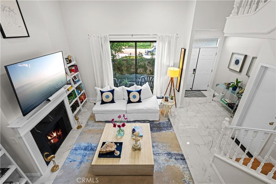 Welcome to this stunning 3-bedroom, 2.5-bath front-end townhome nestled in the heart of Pasadena within a private, gated community. Step through the formal double-door entry into a bright and open living space featuring soaring ceilings, porcelain tile floors, and a cozy gas fireplace. The chef’s kitchen is equipped with stainless-steel appliances, quartz countertops, and an adjacent dining area that flows seamlessly into the living room—perfect for entertaining.

Upstairs, you’ll find three spacious bedrooms with bamboo flooring, including a luxurious master suite complete with a walk-in closet and private bath. The laundry room is conveniently located on the upper level. High ceilings and an open floor plan create a sense of space and light throughout the home.

Additional features include recessed lighting, a brand-new central air and heating system, an attached garage with storage cabinets, an electric car charger, and a charming front patio. Residents enjoy community amenities such as a swimming pool, picnic area, courtyard, and beautifully landscaped grounds. 

Ideally located near the Metro Station, Caltech, Pasadena City College, Old Town Pasadena, and the Lake Avenue shopping district, this townhome offers a perfect blend of comfort, convenience, and style.