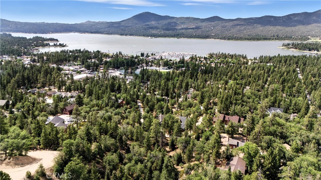 Build Your Dream Estate with Lake Views. Welcome to Knickerbocker Ridge, an exclusive opportunity to own in one of Big Bear Lake’s most sought-after upscale subdivisions. This estate-sized .89-acre parcel is surrounded by multi-million-dollar homes, offering the perfect canvas to design your luxury mountain retreat.
Highlights include A generous 38,889 sq ft lot in prestigious Knickerbocker Ridge, Partial lake views (trees on lot could be removed during build for expanded views)
Prime Location: 3 mins to Big Bear Lake access, 3 mins to The Village for dining & shops, 6 mins to Snow Summit Ski Resort, 7 mins to Big Bear Alpine Zoo, 9 mins to Boulder Bay Park, 10 mins to Bear Mountain Ski Resort.
Imagine mornings overlooking the serene lake, evenings by the fire under the pines, and quick access to everything Big Bear offers – all from your custom-built luxury home.
Bring your vision to life in this rare opportunity.
Contact us today for details on making this premier Big Bear property yours.