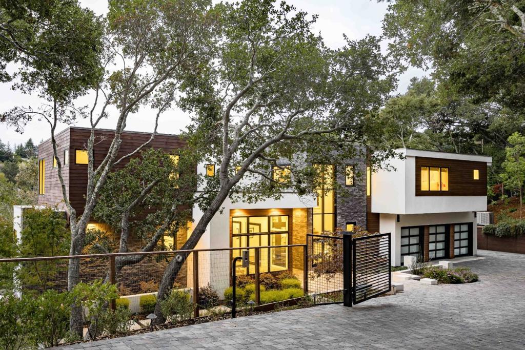 This Hillsborough estate is a true masterpiece of contemporary design and craftsmanship. Nearly 5,700 sf of total living space. Spanning three levels, the home is filled with exquisite details and premium materials, with a bold use of glass that floods every corner with natural light. A magnificent great room, a gourmet kitchen, and an inviting family room provide ideal venues for both entertaining and daily life. Designed for seamless indoor/outdoor living, glass walls fully retract to reveal five-star grounds with an infinity pool, an outdoor kitchen, and patio space. Each bedroom is en suite, with the stunning primary suite boasting a fireplace and a private balcony, while the detached guest home provides an additional bedroom and bathroom. Conveniently close to downtown Burlingame, a prestigious country club, parks, SFO, and commute options. Additionally, families will appreciate access to top-rated public schools and nearby private institutions (buyer to verify eligibility).
