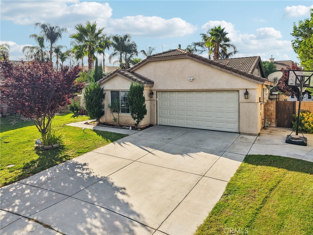 Spacious Cul-de-Sac Home on a Large Lot. Located at the end of a quiet cul-de-sac, this inviting home sits on a large lot and offers a comfortable open floor plan with great indoor-outdoor flow. A charming covered front patio welcomes you inside to the open living room, kitchen, and dining area. The kitchen features granite countertops and a convenient dining space, while a sliding door from the living room leads to a spacious backyard with a covered patio—perfect for outdoor dining and relaxation. An additional living room off the kitchen provides flexible space for entertaining or a cozy family retreat. The privately situated primary bedroom includes an en suite bathroom with dual sink vanity, soaking tub, and separate tiled shower. Two additional bedrooms and a full bathroom are located on the opposite side of the home. Other highlights include a laundry room off the kitchen, a storage/tool shed with electricity, and leased solar for energy efficiency. Conveniently located near local markets, schools, and dining options.