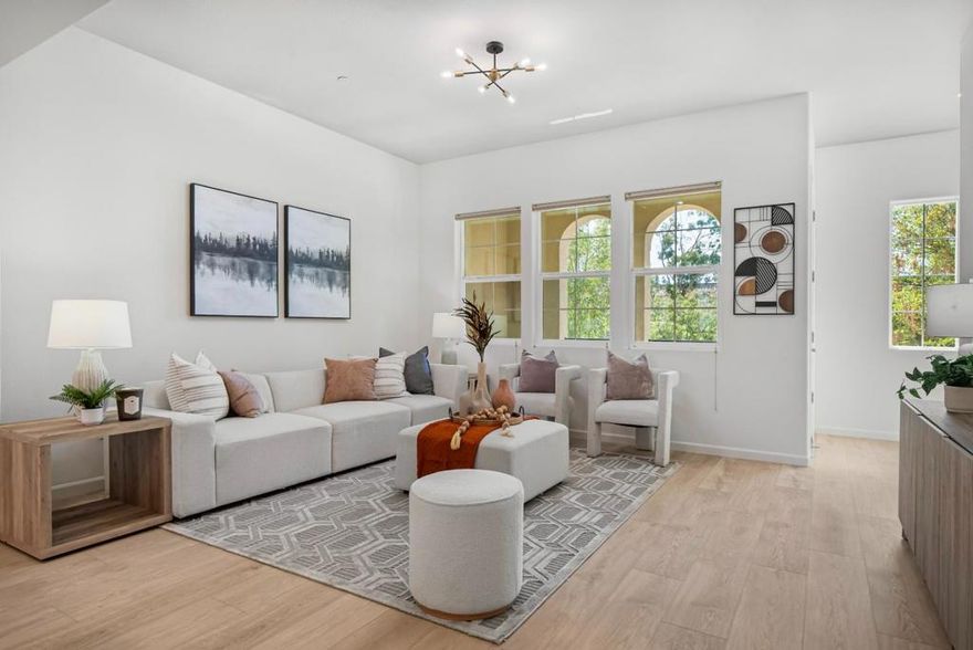 This highly sought-after 4-bed, 3.5-bath townhome offers over 2,100 sq ft of light-filled living space in a newer community with beautifully landscaped surroundings. The open-concept main level showcases soaring ceilings, a spacious living/dining combo, and a gourmet kitchen with stainless steel appliances, gas cooktop, granite countertops, and a covered balcony for year-round enjoyment. Brand-new luxury vinyl plank flooring flows throughout, while the primary suite features a private balcony, spa-like en-suite bath, and generous walk-in closet. A first-floor bedroom with an attached bath provides excellent flexibility perfect for guests or rental income. Additional highlights include LED recessed lighting, a dedicated laundry room, and a tankless water heater. Ideally located near shopping, dining, and top-rated schools with easy access to 880, 84, and 680, plus major employers like Tesla, Meta, Kaiser, and Costco this home is the perfect blend of modern design, comfort, and convenience.