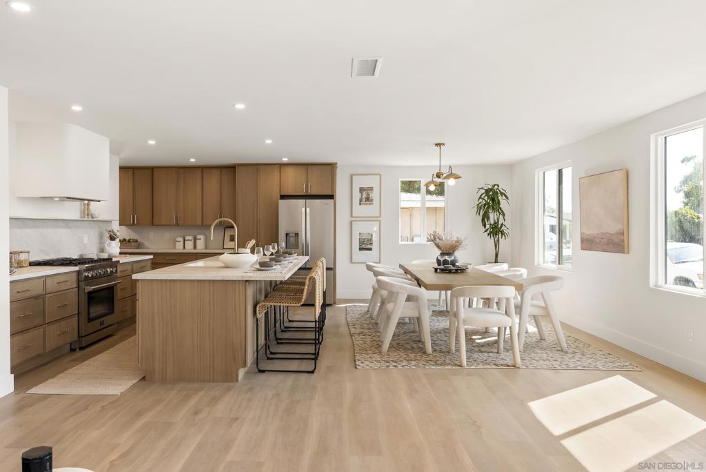 Custom Remodeled Home in Bay Ho – This 4 bed, 3 bath dream home was fully reimagined with high-end style and function in mind. From the moment you walk in, the open layout, natural light, and designer touches make it feel like the perfect mix of luxury and comfort.   The kitchen is the real showpiece—dual sinks, built-in coffee bar, wine fridge, and endless custom cabinets. The oversized island is made for dinner parties, Sunday brunch, or just hanging out with friends.  Upstairs, the primary suite feels like a private getaway with its own balcony over looking the canyon, spa-like bathroom with the massive walk-in shower, and plenty of closet space. Every bathroom has been upgraded with modern tile, sleek vanities, and high-end finishes. 3 more bedrooms give you options—whether you need guest space, a home office, or a creative studio.  Step outside to a fully fenced yard with mature fruit trees; peach, lime, orange, fig, avocado and more. With plenty of room to entertain, garden, or even add a pool. It’s the kind of outdoor space that makes you actually want to host.  Located in the charming neighborhood, Bay Ho you’re only minutes from the beach, restaurants, freeways, and shopping. This home nails the balance of gorgeous design and everyday living—perfect for anyone ready to put down roots in San Diego without giving up style.