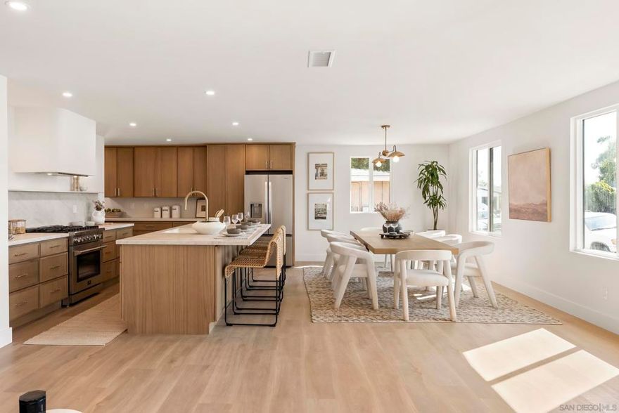Custom Remodeled Home in Bay Ho – This 4 bed, 3 bath dream home was fully reimagined with high-end style and function in mind. From the moment you walk in, the open layout, natural light, and designer touches make it feel like the perfect mix of luxury and comfort.   The kitchen is the real showpiece—dual sinks, built-in coffee bar, wine fridge, and endless custom cabinets. The oversized island is made for dinner parties, Sunday brunch, or just hanging out with friends.  Upstairs, the primary suite feels like a private getaway with its own balcony over looking the canyon, spa-like bathroom with the massive walk-in shower, and plenty of closet space. Every bathroom has been upgraded with modern tile, sleek vanities, and high-end finishes. 3 more bedrooms give you options—whether you need guest space, a home office, or a creative studio.  Step outside to a fully fenced yard with mature fruit trees; peach, lime, orange, fig, avocado and more. With plenty of room to entertain, garden, or even add a pool. It’s the kind of outdoor space that makes you actually want to host.  Located in the charming neighborhood, Bay Ho you’re only minutes from the beach, restaurants, freeways, and shopping. This home nails the balance of gorgeous design and everyday living—perfect for anyone ready to put down roots in San Diego without giving up style.