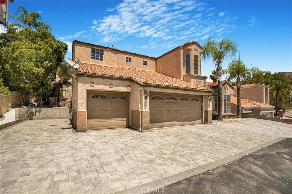 Beautifully updated home in desirable 91387 with stunning views and abundant natural light. Features a spacious primary suite with private balcony, double-sided fireplace connecting the dining area and den, and an open, airy floor plan. Enjoy RV parking with full hookups and EV charging stations. Perfect for comfortable, modern California living!