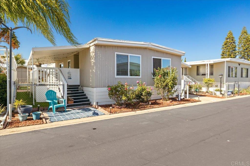 Welcome to this spacious and move-in ready 2-bedroom, 2-bath home located in the desirable Lamplighter community of Oceanside - an all-ages, gated, rent-controlled park with low space rent. Boasting 1,344 sq. ft. of well-maintained living space, this home features a functional layout, a newer heater, hot water heater, and dishwasher, offering comfort and peace of mind. The Lamplighter community includes resort-style amenities such as a pool, spa, and clubhouse, all within minutes of shopping, dining, major freeways, and the beautiful Oceanside beaches. Enjoy Southern California living in an amenity-rich, welcoming neighborhood in an unbeatable location.