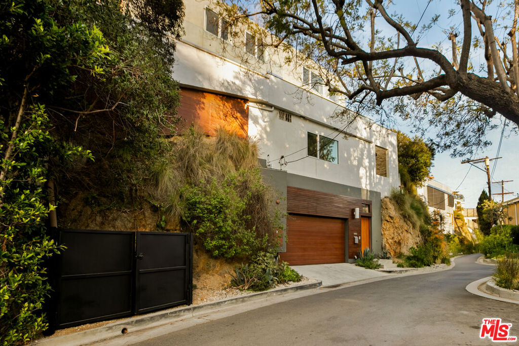 This home and all our listings are available immediately to assist displaced victims from the fires. Available fully furnished and turnkey for short, midterm, or long term lease! Vibrant modern Hollywood Hills home with stunning ocean & city views. This newly constructed 4 bedroom home has an open floor plan, 2 large patios on 2 levels, a full sized heated pool & a custom 2 story waterfall. From the concrete aesthetic on the walls to the oak floors, this home is perfect for entertaining. This homes uniqueness, with bright interior finishes & high-end materials, creates a spirited style. This property is also available for sale.
