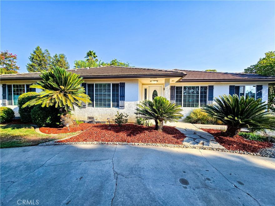 A beautifully maintained home located in the very desirable Fig Garden Area near Van Ness Extension. This gorgeous home features 3 large bedrooms and 2 1/4 bathrooms; tile roof, elegant laminate wood flooring along with tile and carpet in the bedrooms. A separate living and family rooms provide ample space for relaxation and entertaining, while a dedicated game room overlooking the incredible backyard and pool. The exterior of the property has very attractive landscaping and an inviting swimming pool, recently replastered for optimal enjoyment. A circular driveway enhances the curb appeal and provides convenient parking for residents and guests. This home offers the best of both worlds: a peaceful and spacious setting with the conveniences of nearby amenities.