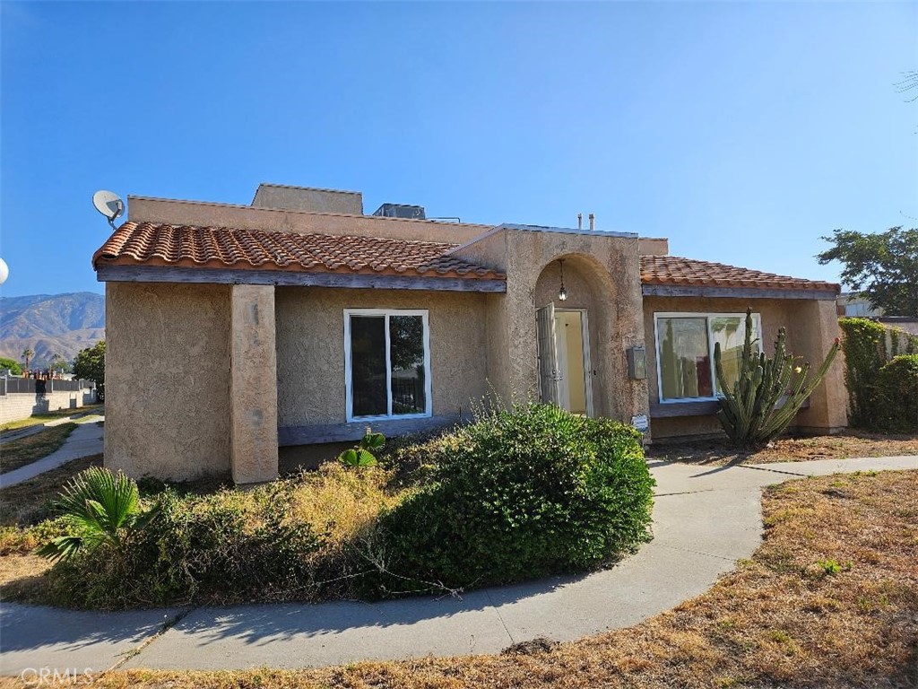 Come see this well-maintained 2-bedroom, 2-bathroom condo with new windows. This property offers a spacious layout, fresh paint and tile flooring throughout. There is a bright and airy living area, complete with large windows that bring in plenty of natural light. The open-concept kitchen features ample cabinetry and a cozy dining area, ideal for both everyday meals and entertaining. . Additional highlights include in-unit laundry, central A/C and heating, and a large patio leading to the garage and carport. This community features a pool, open spaces, and assigned parking. Conveniently located near shopping, dining, parks, and freeway access, this home offers both comfort and convenience.