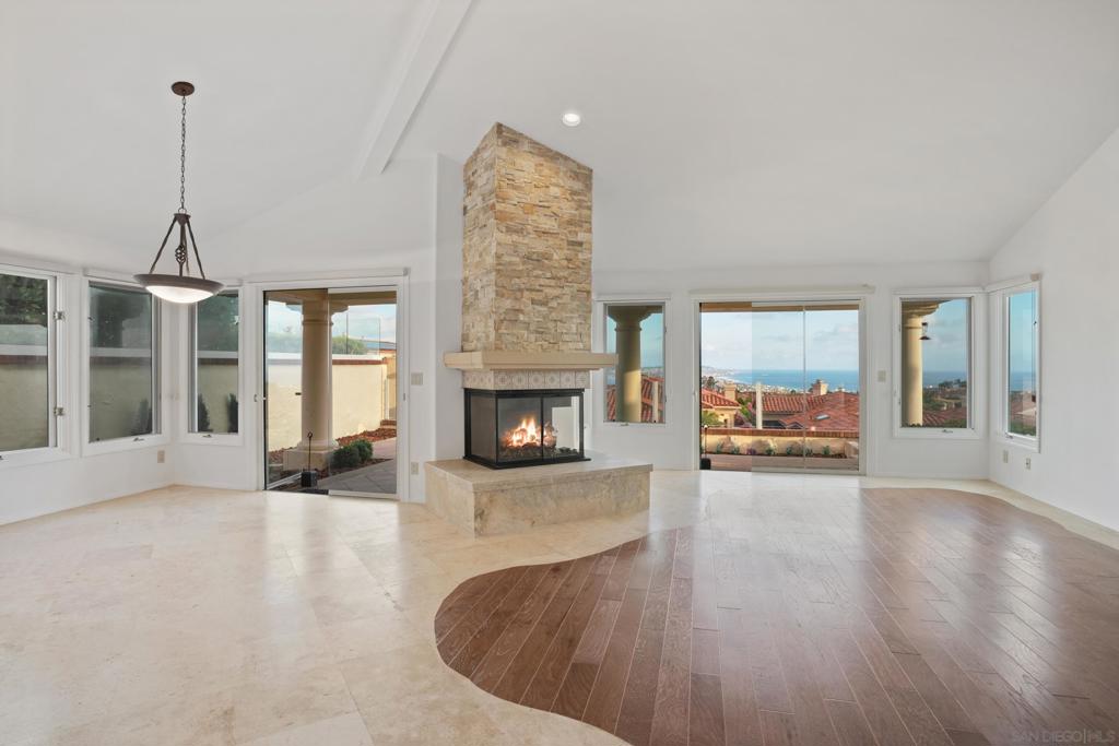 Coastal living with panoramic views in La Jolla’s coveted Crystal Bay gated community. Freshly painted inside and newly updated landscaping. Enjoy sweeping views of the ocean, Mission Bay, Pacific Beach, and SeaWorld fireworks from multiple vantage points throughout the home. A gated courtyard creates an inviting entry, connecting the detached guest casita and main house front door. Inside, a spacious single-level floor plan flows effortlessly from the formal living and dining areas to an open-concept kitchen and family room with vaulted ceilings, oversized windows, and a cozy stone fireplace. The primary bedroom suite offers its own fireplace, backyard access, two walk-in closets, and an ensuite bath with separate tub and shower for a luxurious retreat. Perfect for entertaining, the backyard can be accessed from the dining room, living room, and primary bedroom, leading to three distinct patios ideal for al fresco dining, sun-soaked lounging, and peaceful relaxation. The detached guest casita provides additional privacy and versatility. Additional features of the home include 14 solar panels, a dedicated laundry room and detached two-car garage with a Tesla charging station. Exclusive access to Crystal Bay’s resort-style amenities—pools, spa, clubhouse, fitness center, and tennis/pickleball courts—completes this incredible offering. Ideally located just minutes from La Jolla's beaches, shops, and dining!