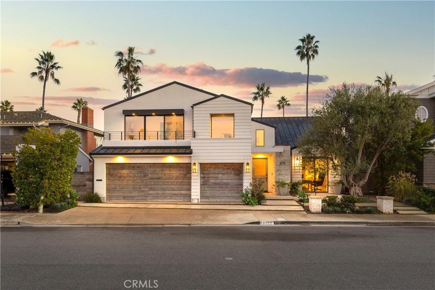 Set in the coveted SeaCliff neighborhood of Huntington Beach, this coastal modern home has been completely rebuilt with premium craftsmanship and high-end finishes. Inspired by The Surfrider boutique hotel and classic California surf culture, the home delivers an elevated beach-resort feel throughout. Taken essentially to the studs in 2017, it features updated electrical, plumbing, insulation, and a metal roof. The chef-inspired kitchen opens to a spacious living area with a custom fireplace and includes a SubZero refrigerator with custom panels, Wolf 6-burner range with griddle, double convection oven, warming drawer, built-in Miele coffee maker, quartz counters, and the signature “whale tail” backsplash. LaCantina pocket doors expand the space to the backyard “California room,” surrounded by custom landscaping with grapevines, succulents, plumeria, mature crane-placed trees, stone tile, turf, custom awnings, a built-in Sedona BBQ, and an elevated Caldera spa. A downstairs bedroom with nearby full bath adds convenience. Upstairs, a generous lounge with built-ins anchors the second level. The primary suite features a large walk-in closet with reclaimed wood barn doors and a spa-style bath with jetted tub, walk-in shower, and dual sinks. Additional highlights include white oak flooring, Lincs audio, Lutron lighting, Anne Sacks tile accents, custom wallpaper, central cooling, automated sprinklers/drip system, and an outdoor shower. Just minutes from the beach and top-rated SeaCliff schools, this home offers luxury coastal living at its finest.