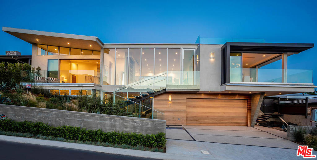 Pacific Palisades new construction coastal modern, Castellammare area with protected views. Panoramic ocean, whitewater, mountain, city views from Catalina to Pt. Dume. Only a few blocks from the beach, an ideal WFH 2-level has 6,876 SF & 5 BR/7 BA, with separated lower floor plan & spaces on a 9,761 SF lot. By architect Colby Mayes, features include floor to ceiling glass doors opening to multiple decks, 689 SF two-story glass atrium & massive 1,700 SF roof top deck w/270-degree vus. Upper level has ocean vu master BR w/balcony, fp, & spa bath w/steam & soaking tub. Living areas w/glass walls, dining rm, fam rm, gallery art wall & en-suite BR/office. Kitchen w/elevator & Wolf/Subzero connects to fam rm & backyard w/saltwater pool & spa. Lawn, fire-pit, BBQ, outdoor shower. Lower level has 3 large en-suite BRs, 2nd fam rm, theater, gym, laundry/pet spa, koi pond. Control 4, Lutron shade system, security already installed. Oak & concrete floors, book-matched stone slabs. One of a kind!