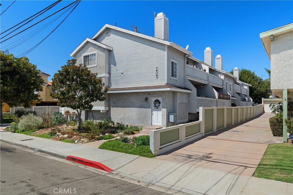 NEW PRICE! Welcome to 2609 Vanderbilt Lane #4, a bright and inviting move-in-ready end-unit townhome in the heart of Redondo Beach. With only one shared wall and windows on three sides, this home enjoys abundant natural light and a great sense of privacy. The main level features an open living and dining area with brand-new flooring, fresh paint, and access to a private balcony. The kitchen has been updated with new appliances and showcases classic oak cabinetry with plenty of storage and counter space. A half bath is also located on this floor. Upstairs you’ll find two generous primary suites, each with vaulted ceilings, walk-in closets, and en-suite bathrooms. One suite also includes a private balcony. The laundry is conveniently located on this level as well. Downstairs features a third bedroom or office, a large closet, and direct access to the oversized two-car garage. Additional highlights include rebuilt balconies with new waterproofing and thoughtful updates throughout. Set in a well-kept community close to beaches, parks, shopping, top-rated schools, and with easy freeway access, this home offers the perfect blend of comfort, convenience, and coastal living.