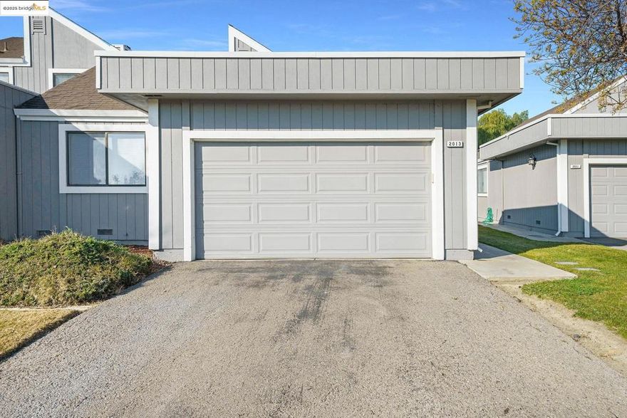 This charming end unit offers desirable single-story living with 2 bedrooms, 2 baths, inside laundry, a separate dining area, and a convenient wet bar. Relax in the inviting family room featuring a cozy fireplace and sliding doors that open to your private (Newer trex-deck) overlooking the lagoon and clubhouse. The primary suite also includes its own sliding door for easy outdoor access. Nestled in a secure, gated community, this townhouse blends comfort, convenience, and a beautiful setting.