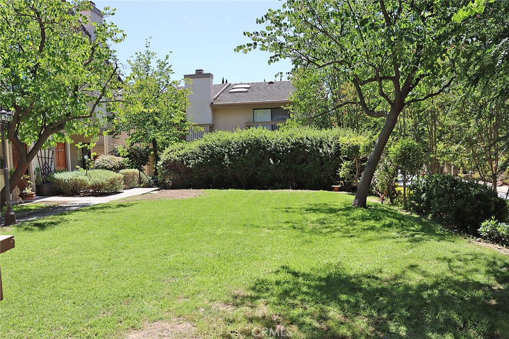 Discover comfort and style in this beautifully maintained townhouse located in the highly desirable community of Alizia Canyon Townhomes in Calabasas. This light-filled 3 bedroom, 2.5 bath home offers spacious living with an open floor plan and high ceilings. In the living room is a fireplace and a slider that leads to the front patio area. The kitchen has a built-in microwave and plenty of cabinets plus a greenhouse window that lets in the light. All three bedrooms are upstairs. The primary suite boasts vaulted ceilings, a walk-in closet and a private bathroom. The two additional bedrooms share a full bathroom. The home also includes an attached two car garage with direct access into the home and a washer and dryer there for your convenience, plus a second refrigerator. Take advantage of the wonderful amenities this community has to offer, a pool, tennis and the added bonus of being in the Las Virgenes school district. There is street parking right next to the home for added convenience.