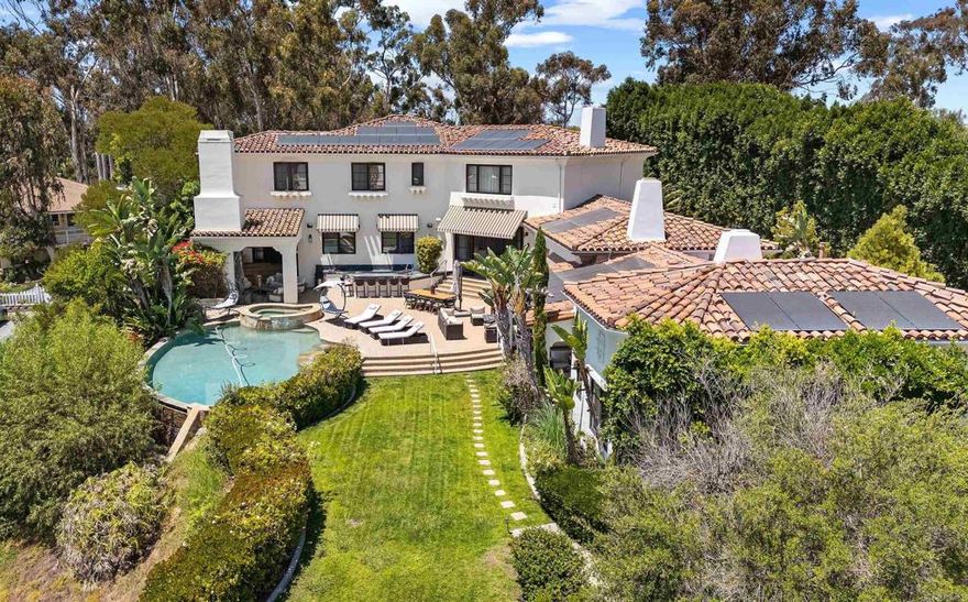 Welcome to The Bacara House on Del Mar Mesa a one-acre estate with sunrise views over the canyon and The Grand Golf Club. Offering more than 8,100 sq. ft. of thoughtfully designed living space for both everyday comfort and effortless entertaining. This residence includes seven bedrooms, nine bathrooms, an executive office, maid’s quarters, and detached guest quarters with a private ensuite. The executive office overlooks the resort-style backyard, complete with a pool and spa, outdoor bar, fireplace, multiple lounge and dining areas, and a spacious greenbelt for kids and pets. Car enthusiasts will appreciate the attached 4+ car garage, along with a detached RV-sized garage ideal for boats, trailers, or a car collection. Just minutes from One Paseo, The Grand, and the three-Michelin-star Addison. Secure gated entry, a long private driveway, and a quiet road provide exclusivity. Owned solar included.