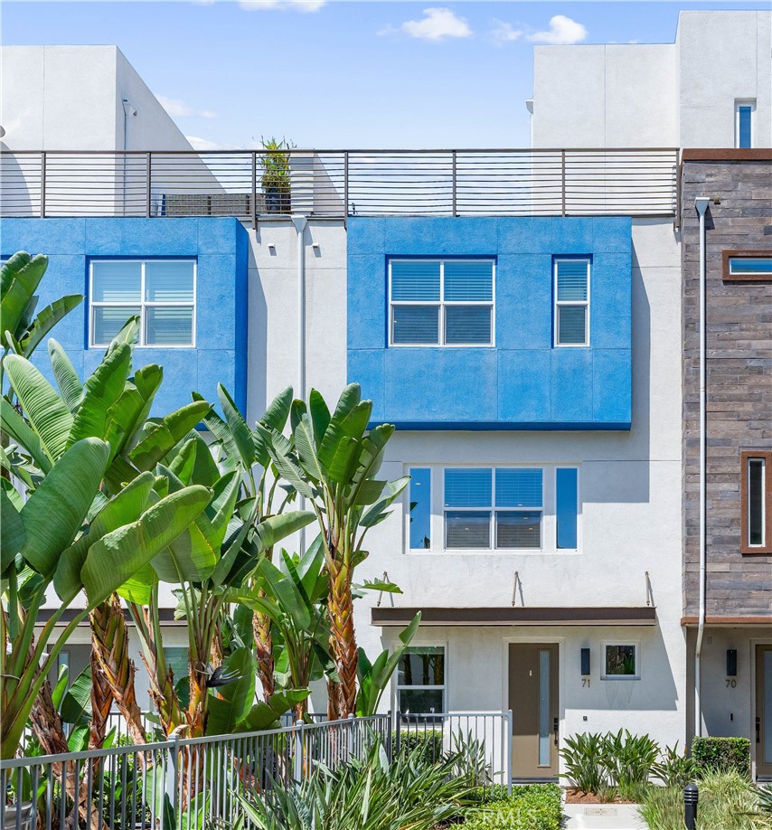 Bright. Modern. Move-in Ready. This is 949 E Mason Ln #71 — a stylish tri-level townhome in the heart of Anaheim’s Platinum Triangle. With nearly 2,000 sq ft of light-filled living space, this Trumark-built townhome showcases modern features across all 3 floors. Upon entry, you are greeted with a bright and spacious main floor flex space —perfect for your home office or gym—with its own half bath and direct garage access. Up the stairs you will find an open-concept kitchen, dining, and living area with clean lines, high ceilings, and quality finishes. The kitchen is outfitted with stainless steel appliances, quartz countertops, and sleek cabinetry—perfect for both entertaining and everyday living. All 3 bedrooms are on the upper level, including a spacious primary suite with walk-in closet and dual-sink bath. The showstopper? Your own private rooftop deck for lounging, hosting friends under the stars, and soaking up the SoCal sun. Additional amenities include an EV-ready 2-car garage with storage and a beautiful, resort-style pool and the location is hard to beat - minutes from Disneyland, the Honda Center & Angels Stadium, the up-and-coming OCVIBE and major freeways. Modern living, low maintenance, and a location that puts you in the mix. This one’s a must-see.