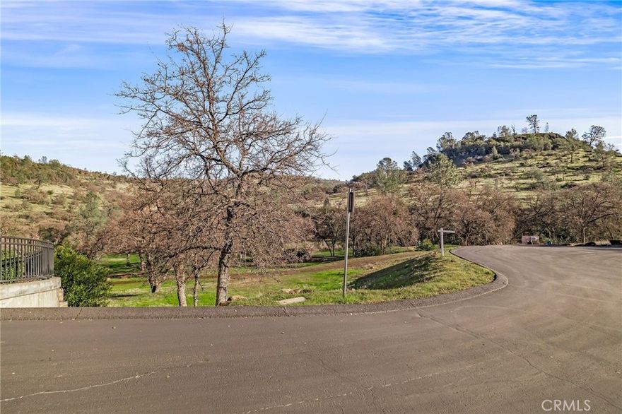Build your dream home on this stunning vacant lot, located in the Canyon Oaks Country Club gated community! Spanning nearly half an acre, this prime property is perfectly situated at the end of a quiet cul-de-sac, ensuring ultimate privacy with no through traffic or noise. Nestled alongside the 10th tee, the lot boasts a serene setting surrounded by beautiful mountain bluffs, mature oak trees and views. All utilities are on-site and ready for your custom design. Picture yourself relaxing on your future backyard patio, enjoying the shade on warm summer afternoons, listening to the soothing sounds of birds and a nearby babbling brook, and taking in the breathtaking natural scenery. This is a wonderful opportunity to create your own peaceful retreat in one of Chico’s most sought-after communities.